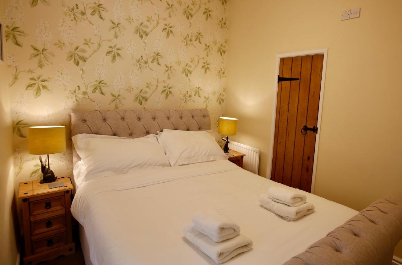 Ashfield House Hotel Grassington Quarto foto A bedroom at the Old Post Office