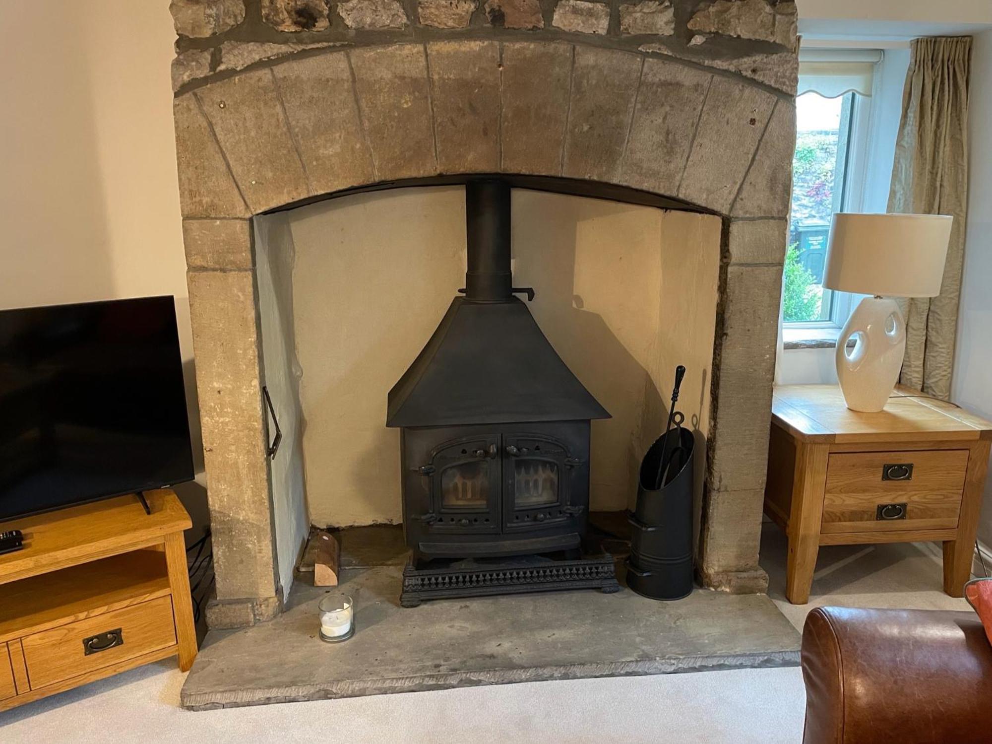Ashfield House Hotel Grassington Quarto foto The fireplace in the living room
