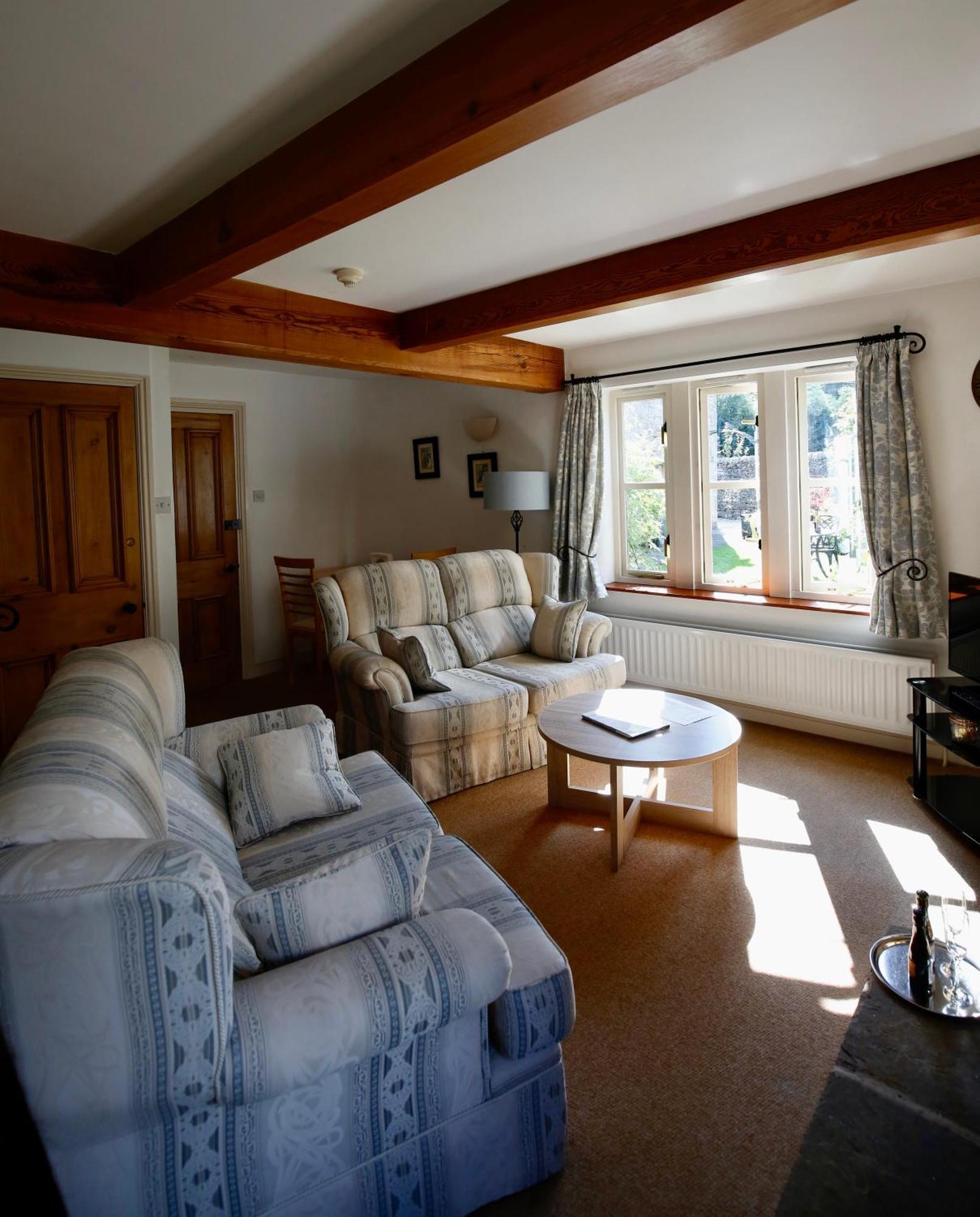 Ashfield House Hotel Grassington Quarto foto The living room at The Old School House